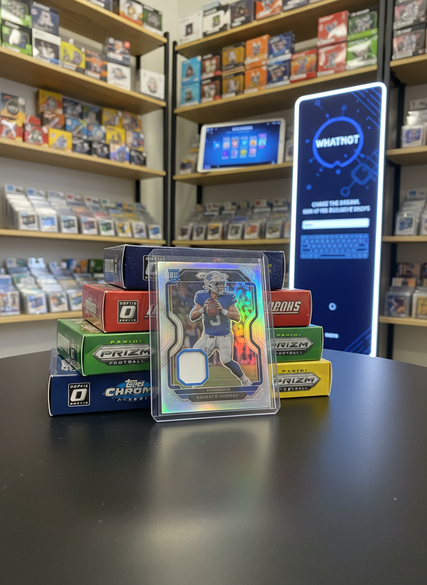 A close-up, low-angle photographic realism shot of a single standout sports card in a crystal-clear one-touch case, propped dramatically against a stack of sealed retail blaster boxes in a bold card shop environment. The card’s foil accents shimmer under bright, directional studio lighting, throwing subtle reflections onto the matte-black tabletop. Behind, softly blurred shelves are lined with rows of sealed boxes in various team colors, giving depth and context. On one shelf, a glowing tablet displays an abstract Whatnot interface, while nearby a sleek, vertical, screen-like panel hints at an email signup hub. The mood is confident and aspirational, emphasizing rarity, value, and the thrill of chasing big hits from sealed product.